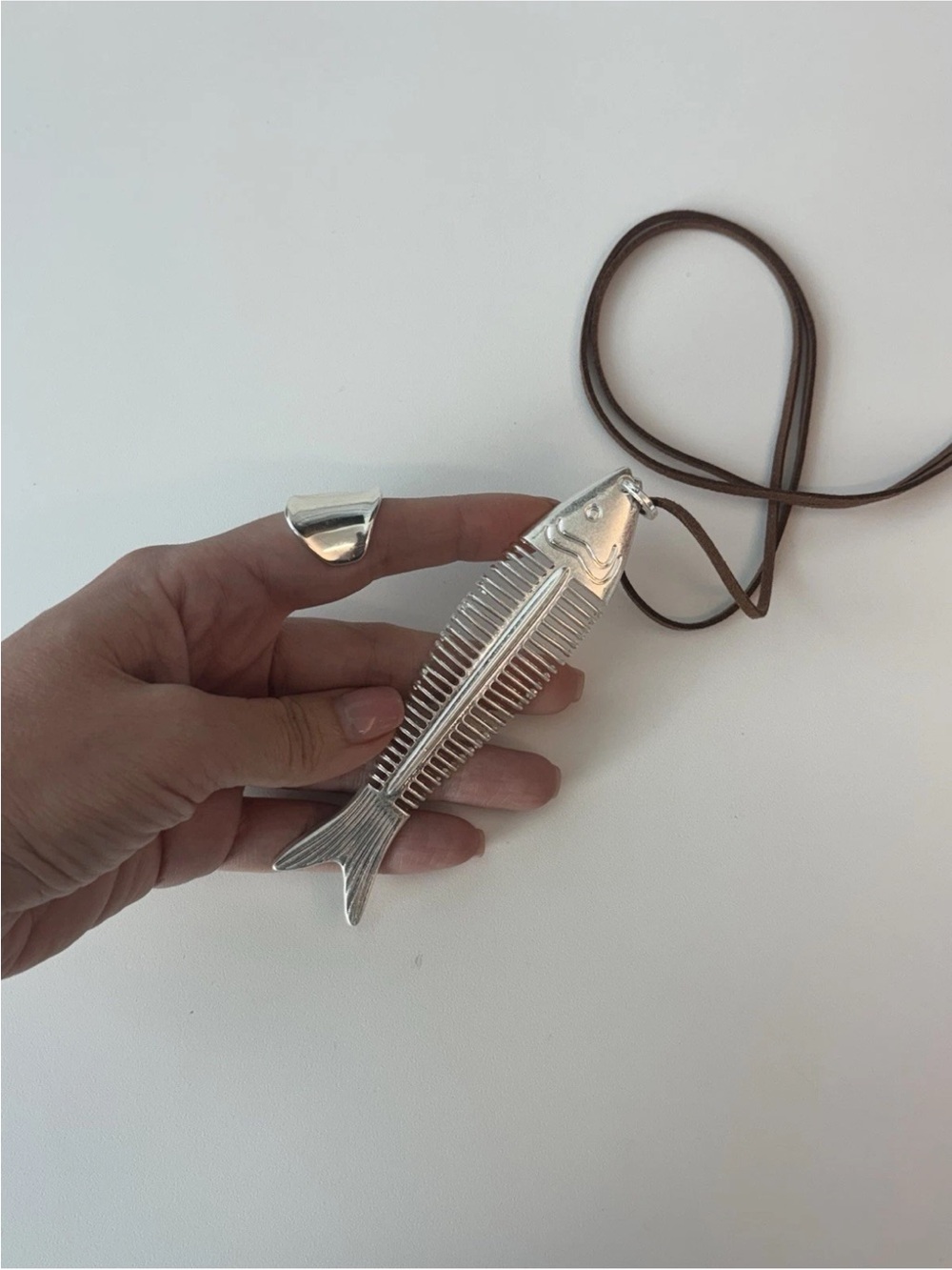 Silver Fishbone Pendant Necklace on Brown Cord
